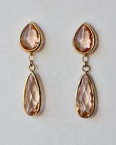 Elegant Earrings with Peach Champagne faceted Teardrop in Gold Plated Bezel setting 15 x 11 mm Post with Earrings backs Faceted Champagne Long Drop in Gold plated Bezel Set 21 x 10mm ( including loop 24 x 10 mm) The total length is 1.5 inches or 42 mm long Beautiful, elegant pair of earrings! Perfect for wedding, graduation, or birthday party! Your order will be gift wrapped and shipped in jewelry gift box. Similar design Earrings - Gold or Silver - https://www.etsy.com/listing/953473086/champag Teardrop Faceted Earrings For Wedding, Faceted Drop Earrings For Wedding, Wedding Teardrop Faceted Earrings, Faceted Teardrop Earrings For Weddings, Gold Briolette Crystal Earrings For Wedding, Gold Briolette Teardrop Earrings For Wedding, Wedding Teardrop Faceted Crystal Earrings, Teardrop Faceted Crystal Earrings For Weddings, Faceted Teardrop Crystal Earrings For Wedding