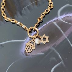 Our elegant Star of David & Hamsa Hand necklace is crafted in beautiful Gold Filled material. The necklace features both the sacred symbols, bringing protection and harmony to its wearer. Embrace the spiritual connection and enjoy the timeless beauty of this piece.     14k Gold Filled   Chain length 18”  Tarnishing resistant   Hypoallergenic   Please note that chemicals and perfume can shorten the life span   Clean your jewelry after each wear with YUMIYU Pouch  Waterproof   Email us  for custom orders :)   Orders ship in 1-3 business days  High-polish, 14k gold finish Hamsa And Star Of David Necklace, Hamsa Hand Necklace, Hand Necklace, Sacred Symbols, Spiritual Connection, Everyday Luxuries, Star Of David, Hamsa Hand, Gift Card Sale