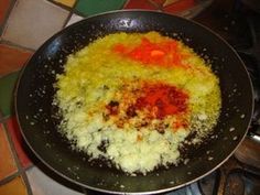 a pan filled with food on top of a stove