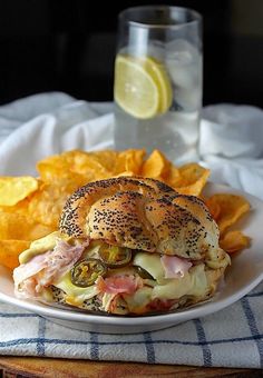 a sandwich and potato chips on a plate