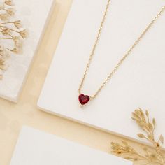 Corin Ruby is a stone of royalty, highly coveted for its rich red hue. This ruby was meticulously cut into the most subtle of hearts so you can wear it every day. It layers well with other dainty necklaces, and alone it almost looks like it is floating on your neck. This is the perfect gift for a girlfriend, daughter, granddaughter or even bridesmaid. - Handmade- Solid Gold- Natural Ruby- Pendant Size: 5 mm- Total Ruby Carat Weight: 0.40 ctw All Sarah Elise ruby jewelry come beautifully boxed in Ruby Heart Necklace, Gold Ruby Necklace, Ruby Heart, Dainty Necklaces, Ruby Birthstone, Ruby Pendant, Ruby Necklace, Ruby Jewelry, July Birthstone