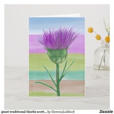 a greeting card with a purple flower in a vase