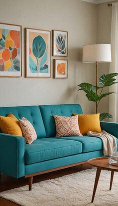 a living room with blue couches and paintings on the wall above them, along with a coffee table