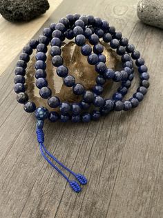 This Lapis Lazuli Mala necklace has a beautiful blue tone that will be easy to match your everyday outfits and keep you calm and grounded if you use it while meditating. Its a unique decor item also. A perfect gift for a yoga lover, or someone that loves stones. You can use it as a necklace or wrap it around the wrist and becomes a bracelet. The Mala necklace has a drop length of 43cm- 17 inch. A most have addition to your jewelry collection. ⚡️Join Akashi's VIP list for early bird discount acce Holistic Blue Beaded Bracelets, Spiritual Round Beaded Bracelets For Meditation, Spiritual Beaded Bracelets For Meditation, Spiritual Blue Beaded Bracelets For Meditation, Spiritual Lapis Lazuli Beaded Bracelets, Adjustable Lapis Lazuli Beaded Bracelets For Meditation, Lapis Lazuli Round Beads Bracelets For Meditation, Blue Spiritual Beaded Bracelets, Spiritual Blue Beaded Bracelets