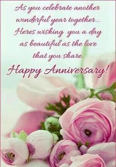 a bouquet of pink flowers with the words happy anniversary written on it in white lettering