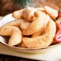 a plate filled with fried food on top of a table