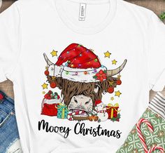 a white shirt with an image of a bull wearing a santa hat