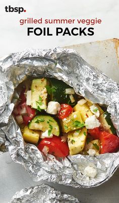 grilled summer veggie foil packs with tomatoes, cucumbers and feta cheese