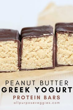 four pieces of peanut butter greek yogurt protein bars stacked on top of each other