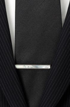 This polished gunmetal tie clip is adorned by a luminous mother-of-pearl inlay for subtly sophisitcated look. 1/4" x 2" Gunmetal plate/mother-of-pearl Imported Luxury Silver Suit And Tie Accessories For Business, Elegant Black Business Lapel Pin, Classic Black Lapel Pin For Formal Occasions, Silver Suit And Tie Accessories For Formal Occasions, Classic Silver Lapel Pin For Business, Silver Elegant Suit And Tie Accessories For Gift, Elegant Silver Suit And Tie Accessories For Gift, Modern Gunmetal Jewelry For Formal Occasions, Elegant Black Lapel Pin For Formal Occasions