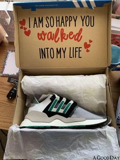 an open shoe box on a table with shoes in it that say i am so happy you walked into my life