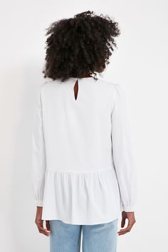 Flowy and flattering, the Carlota Peplum Blouse is a wardrobe must-have. This classic white top features puff sleeves with elastic wrists, keyhole button back closure, high-low silhouette, and a peplum hem detail. Pair with denim and a change of accessories for a fresh look that will take you from desk to drinks with ease! Crew neckline Cuffed sleeves Slightly puffed sleeves High-low Peplum detail Material: 100% Polyester Care: Hand wash cold Plus And Minus, Cocktail Attire, Peplum Blouse, Peplum Hem, Fresh Look, Puffed Sleeves, Cuff Sleeves, Pullover Sweatshirts, Fall Trends