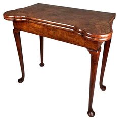 an old wooden table with a marble top