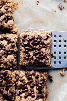 chocolate chip cookie bars cut into squares with a grater