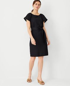 Elevate your wardrobe with the Ann Taylor Linen Blend Boatneck Shift Dress, a testament to understated elegance. This dress is perfect for women who value both style and comfort.

- Size: 00 Regular
- Color: Black
- Gender: Female
- Material: Shell - 55% Linen, 45% Viscose; Lining - 100% Cotton
- Features: Boatneck, shirred short raglan sleeves, self-tie belt, hidden back zipper with hook-and-eye closure, lined body
- Length: 21" from natural waist, hits above the knee
- Care Instructions: Machi Ann Taylor Petite, Shift Dress Black, Petite Dresses, Boat Neck, Modern Woman, Flare Dress, Effortless Style, Linen Blend, Shift Dress