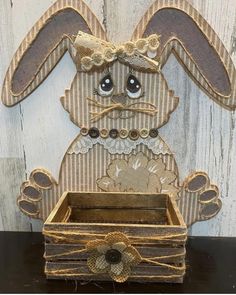 a small wooden box with a bunny on it