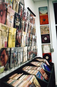 there are many records on the wall in this room