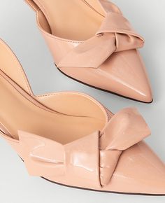 Elevate your ensemble with the Ann Taylor Bow D'Orsay Patent Leather Pumps, a blend of sophistication and comfort. These pumps feature a chic bow-topped d'Orsay silhouette that adds a touch of elegance to any outfit.

- Size: 7
- Color: Camel
- Material: Patent Leather
- Gender: Female
- Heel Height: 2 inches
- Pointy toe design
- Padded footbed for enhanced comfort

Perfect for both office wear and evening events, these pumps are designed to offer comfort without compromising on style. The slee Beige Pointed Toe Heels With Bow, Bow Pumps, Bow Shoes, Leather Bow, 2 Inch Heels, Patent Leather Pumps, Leather Bows, Toe Designs, Leather Pumps