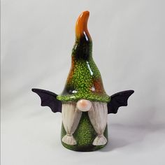 New Green Terra Cotta Halloween Gnome With Witch Hat And Glitter Bat Wings. Measures Approx 10”H. **Item May Have Small Imperfections That Are Typical Of This Type Of Item.**