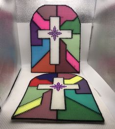 the cross is made out of different colored squares