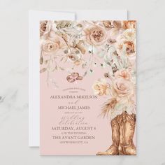 a pink wedding card with flowers and boots on the front, in gold foil lettering