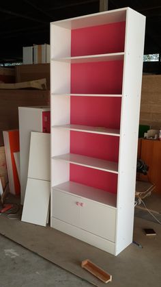 the shelves are painted pink and white with no doors or drawers on them, so they can be used as shelving units