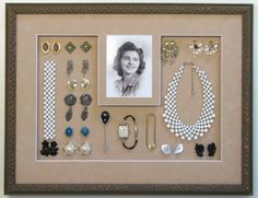 a framed photo with some jewelry on it