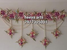 there are many flowers and pearls hanging on the wall with words heeya arts 797 - 35001