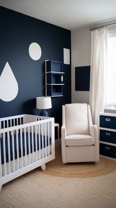 a baby's room with a white crib and blue walls