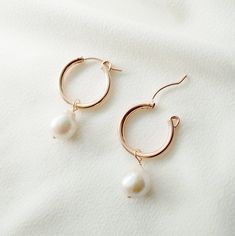 Elegant, classic, and makes a style statement. Our Claudette gold hoop earrings have the most beautiful baroque pearls and will become a staple in your outfits. Pearls symbolize wisdom acquired through experience. The pearl is also said to symbolize the purity, generosity, integrity, and loyalty of its wearer. Pearls are the birthstone for June. Baroque pearls are organically shaped and no two pearls are exactly alike in shape, and we will pair a set that looks beautiful together. As the shapes Gold Coin Jewelry, Rose Gold Hoop Earrings, Vermeil Jewelry, Coin Jewelry, Sterling Silver Hoop Earrings, Religious Jewelry, The Pearl, Sterling Silver Hoops, Silver Pieces