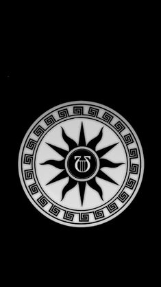 a white and black circular emblem on a black background