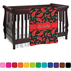 a baby crib with red and green peppers on it, next to color swatches