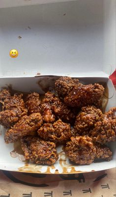 a box filled with fried food sitting on top of a table