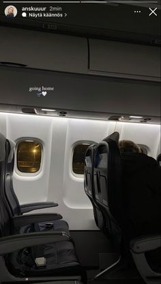 an airplane with two seats facing the window and another seat facing the other direction in front of it