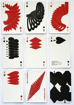 six playing cards with red and black designs on each card are arranged in the same pattern