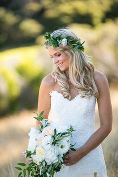 a woman in a wedding dress holding a bouquet