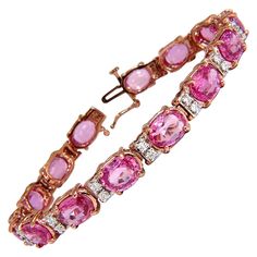 Posh Pinks. 21.74ct. Natural Pink Sapphires & .72ct Diamonds bracelet. Full Oval cuts, great sparkle. Average Each: 6 X 8mm Clean Clarity & Transparent. Vivid Pinks and Prime Saturation. Round Brilliant Diamonds: G-color Vs-2 clarity. Secure pressure clasp and safety catch. 17.6 grams. 14kt. Rose (Pink) gold. Measures 6.75 inches (wearable length) 7.2mm wide. $22,000 Appraisal Certificate to accompany Luxury Pink Sapphire Jewelry, Luxury Pink Diamond Bracelet For Anniversary, Formal Pink Bracelets With Diamond Accents, Pink Diamond Bracelets For Formal Occasions, Pink Sapphire Jewelry, Diamonds Bracelet, Tiaras Jewellery, Emerald Bracelet, Tourmaline Bracelet