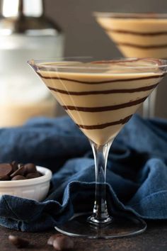 two martini glasses filled with chocolate and ice cream