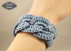 a crochet bracelet is shown on someone's wrist with the clasp undone