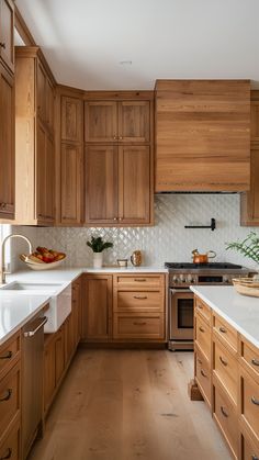 a kitchen with wooden cabinets and white counter tops