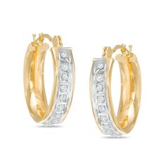 These Diamond Fascination™ hoop earrings are a must-have for her jewelry box. Crafted in warm 14K gold, each dainty hoop is lined along the outer edge with a single diamond accent and Diamond Fascination™ beading, a patented handmade process which crystallizes diamond dust into enamel to simulate round-cut diamonds. Buffed to a brilliant luster, these earrings secure with hinged backs. Gold Hoop Jewelry With Channel Set, 14k Gold Hoop Earrings With Diamond Accents, Fine Jewelry Yellow Gold Hoop Earrings Channel Set, 14k Gold Channel Set Earrings For Anniversary, Gold Channel Set Hoop Earrings For Anniversary, Classic Gold Hoop Earrings Channel Set, Classic Gold Channel Set Hoop Earrings, Diamond Hoop Earrings With Diamond Accents For Anniversary, Yellow Gold Hoop Diamond Earrings Channel Set