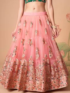 Become the subject of everyone’s conversation by outfitting in this delightful peach color lehenga made with net material designed with mirror work, thread embroidery, and sequin work. This peach lehenga comes with a green color art silk material choli made with embroidery and mirror work. It also comes with a peach color net material dupatta made with thread embroidery and sequin work. This peach lehenga is stitched and can be customized up to 42 inches. The choli will be fully stitched materia Pink Embroidered Skirt For Parties, Embroidered Pink Skirt For Party, Festive Peach Lehenga With Intricate Embroidery, Orange Embroidered Lehenga For Party, Orange Embroidered Party Lehenga, Festive Peach Choli With Intricate Embroidery, Party Embroidered Orange Lehenga, Diwali Peach Lehenga With Resham Embroidery, Bollywood Style Peach Lehenga With Mirror Work