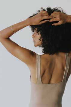 Our updated Christy Bodysuit fit remains our favorite chic layering essential, now sewn in delicate raw silk jersey and updated with a higher leg opening for an ultra-flattering, feminine fit. Designed with a scooped neck, wide straps, and low back— wear it alone paired with a high waisted pant or layer it under a dress or sheer top. Made from 100% silk noil; designed to get better with age and distinguished by the specific, perfectly imperfect texture of raw silk. Seamless Fitted Tops For Relaxation, Beige Fitted Tops For Loungewear, Fitted Bra-friendly Tops For Daywear, Fitted Neutral Tops For Loungewear, Neutral Fitted Tops For Loungewear, Silk Noil, Silk Tee, The Undone, Feeling Good