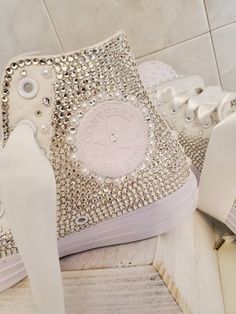 Sparkly Hi-top converse sneakers. Be super fancy and comfy with anything you're wearing.  I can customize to your occasion, age. These will be a huge hit at your wedding, sweet 16, quincenera, dances, birthday parties or just everyday wear. When placing your order please specify what you would like to customize For example: if you want the back stripe to have a date or name or keep design I currently have. I can also customize the front part with crown, you can choose colors Rhinestone colors av Converse Customized, Rose Gold Quince, Hi Top Converse, Converse Sneakers, Hi Top, Gold Pearl, Choose Colors, Keepsake Boxes, Sweet 16