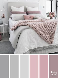 a bedroom with pink and grey colors in the walls, white bedding and pillows