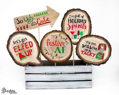 four wooden signs that say it's christmas and festive at the same time