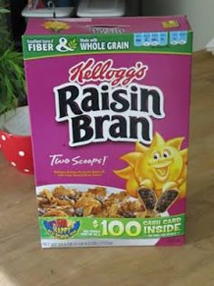 a box of cereal sitting on top of a wooden table