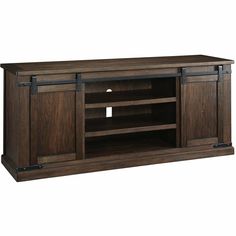 a large wooden entertainment center with sliding doors on the front and side panels, in dark brown