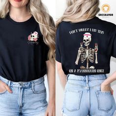 a woman wearing a black shirt with a skeleton on it