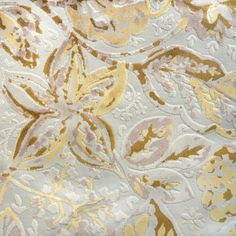 an image of a gold and white floral pattern on fabric or material that is very soft